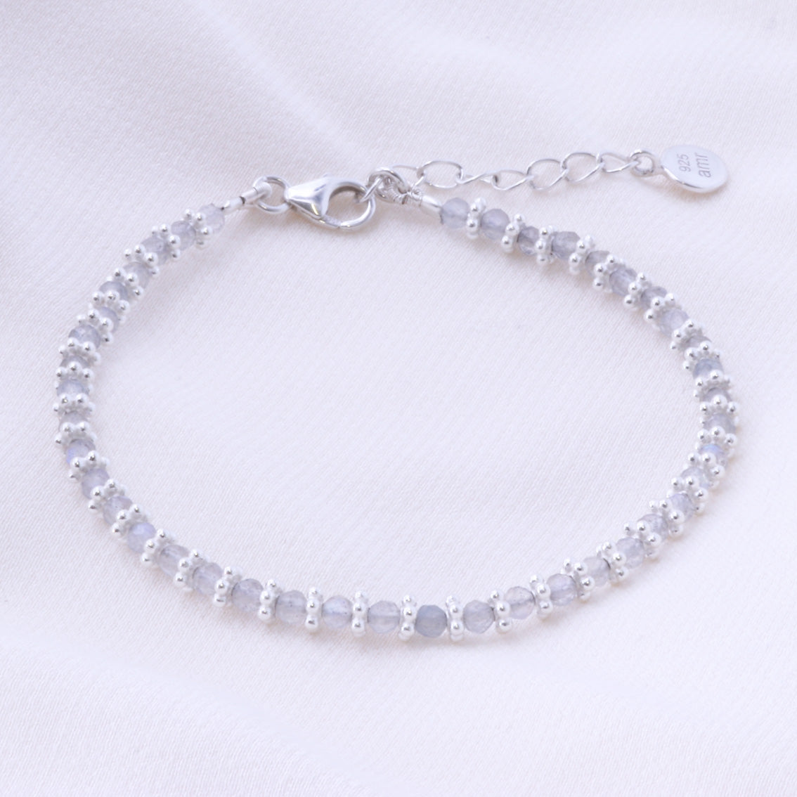 silver labradorite bracelet on a white background