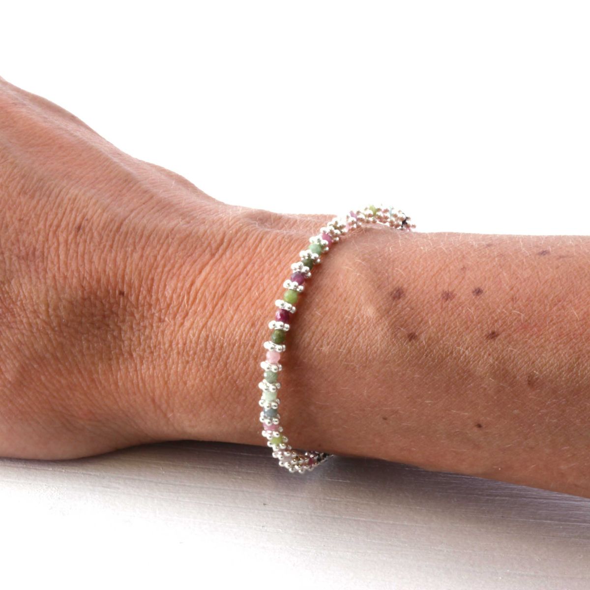 silver tourmaline bracelet on  a woman's wrist