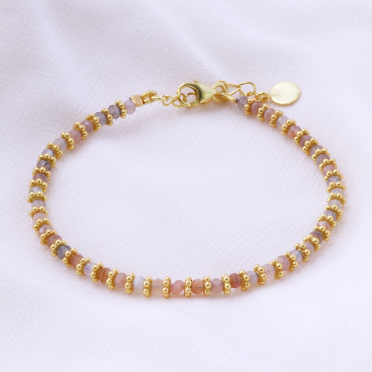 peach moonstone bracelet on a white background